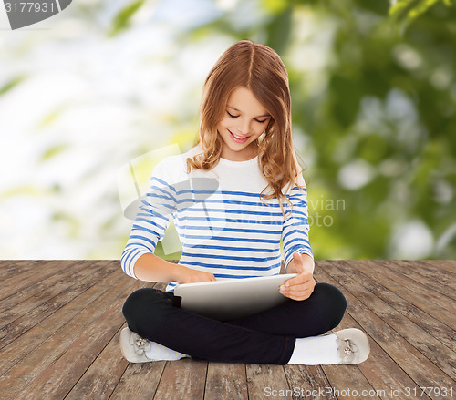 Image of happy little student girl with tablet pc