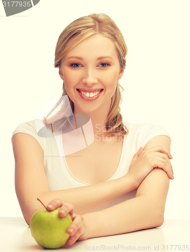 Image of woman with green apple