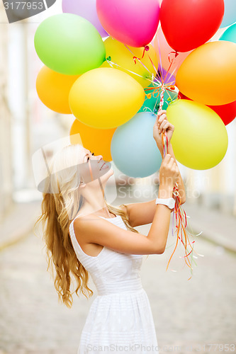 Image of woman with colorful balloons