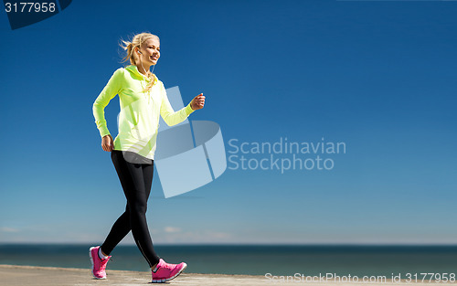 Image of woman doing sports outdoors