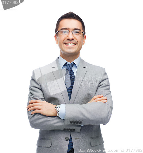 Image of happy smiling businessman in eyeglasses and suit