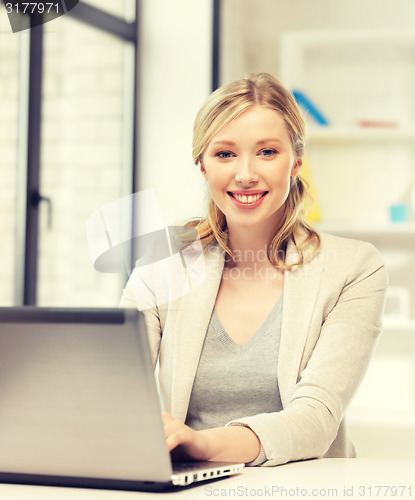 Image of happy woman with laptop computer