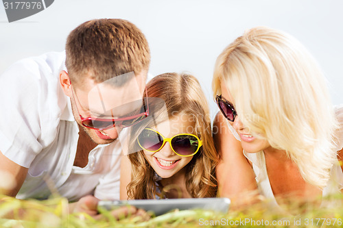 Image of happy family with tablet pc taking picture