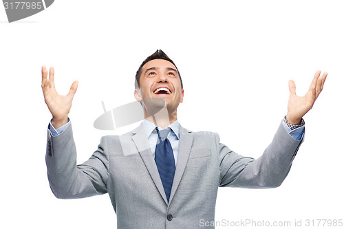 Image of happy laughing businessman in suit
