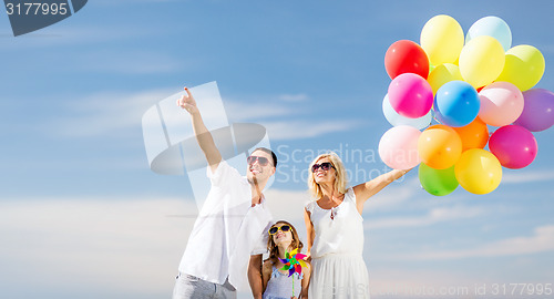 Image of family with colorful balloons