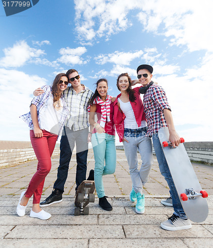 Image of teenagers with skates outside