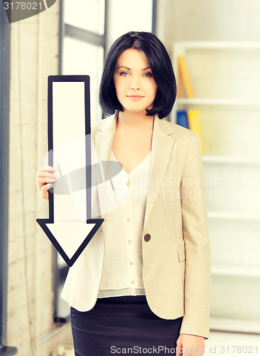 Image of businesswoman with direction arrow sign