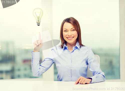 Image of attractive businesswoman at office