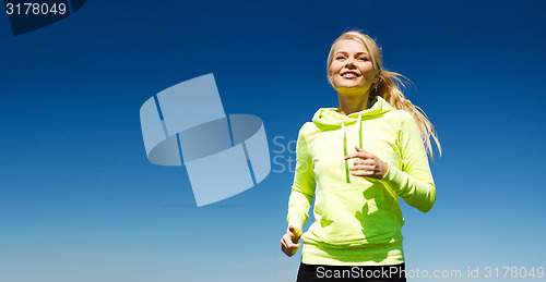 Image of woman jogging outdoors