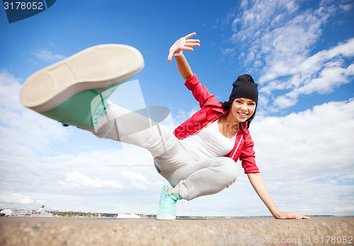 Image of beautiful dancing girl in movement