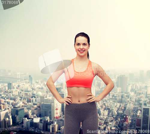 Image of smiling teenage girl in sportswear