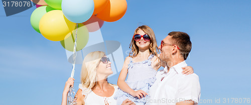 Image of family with colorful balloons