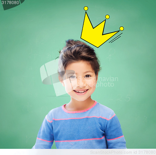 Image of little girl over chalk board background at school