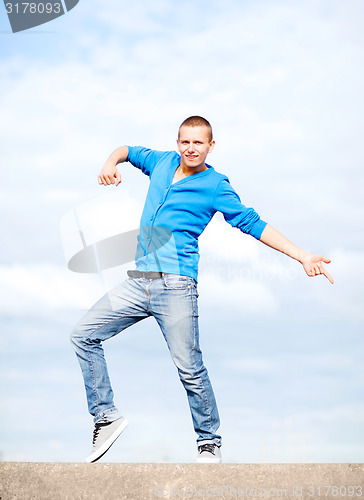 Image of handsome boy making dance move