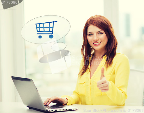 Image of smiling woman with laptop computer shopping online