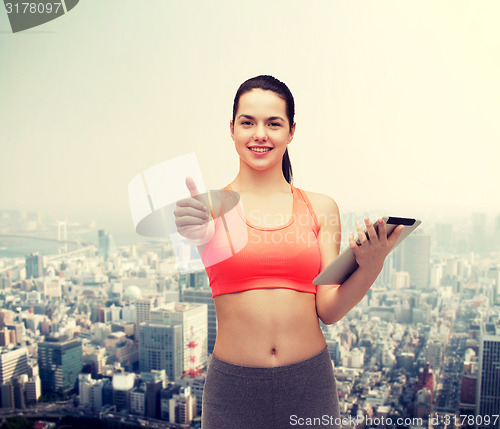 Image of sporty woman with tablet pc computer