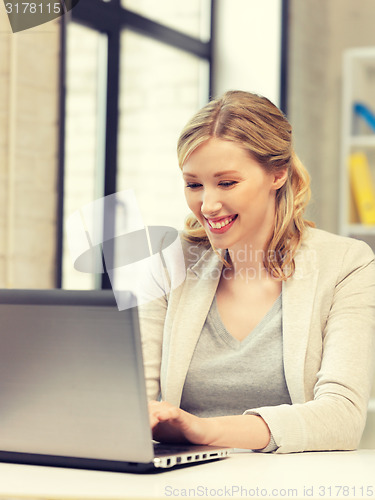 Image of happy woman with laptop computer