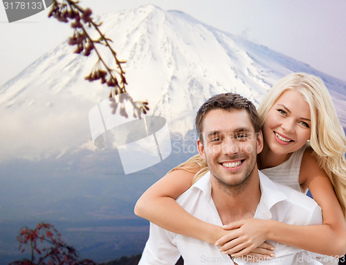 Image of couple having fun on the beach