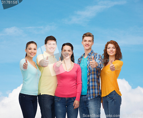 Image of group of smiling teenagers showing thumbs up