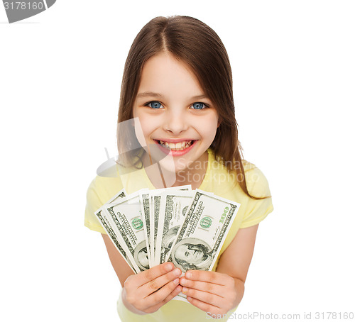 Image of smiling little girl with dollar cash money