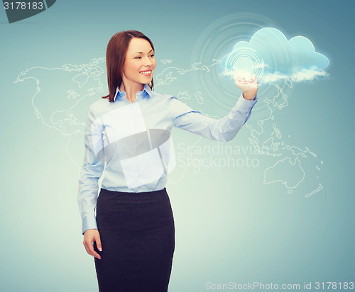 Image of smiling businesswoman working with virtual screen