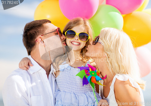 Image of family with colorful balloons
