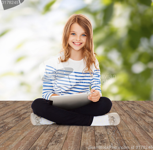 Image of happy little student girl with tablet pc