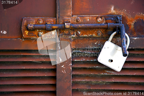 Image of   closed rusty door   varese italy mornago