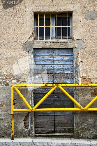 Image of brown door        in  the milano old   window closed brick terra