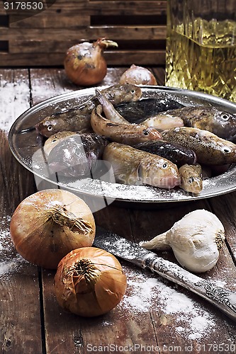 Image of raw fish on the table cooks