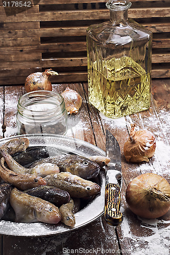 Image of raw fish on the table cooks