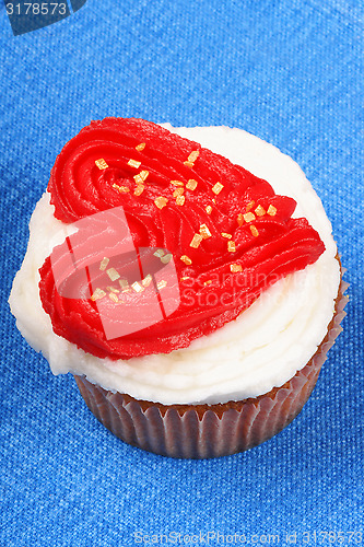 Image of Valentine's day cupcake over a blue background