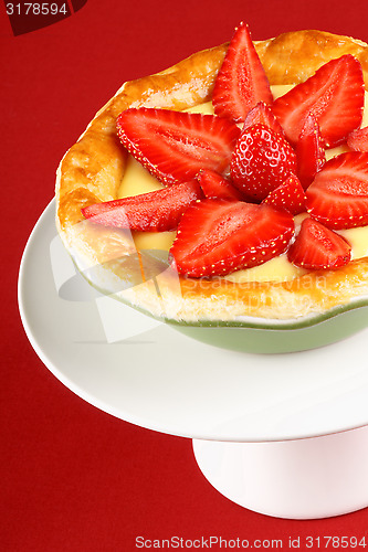 Image of Strawberry and custard tart on a cakestand