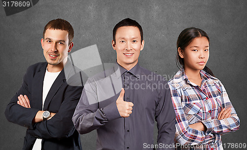 Image of Asian team and Businessman In Suit