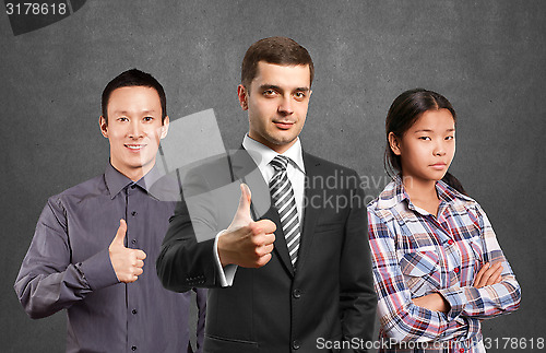 Image of Asian team and lamp head business people with laptops
