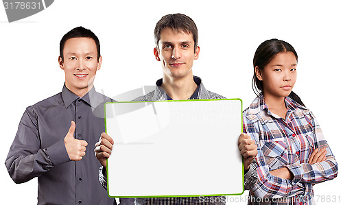 Image of Asian team and male with write board in his hands