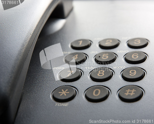 Image of Black landline phone.