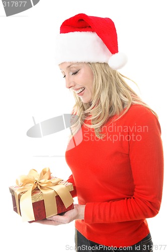 Image of Smiling woman holding a Christmas gift