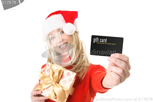 Image of Woman holding gift card, credit card etc