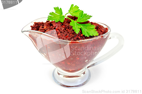 Image of Adjika in glass gravy boat with parsley