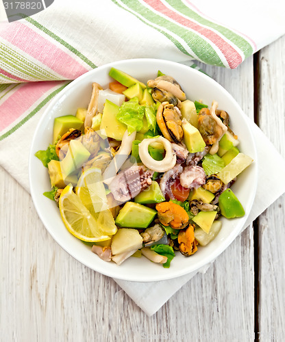 Image of Salad seafood and avocado on white board