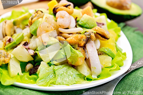 Image of Salad seafood and avocado on green napkin