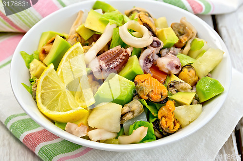 Image of Salad seafood and avocado on linen napkin