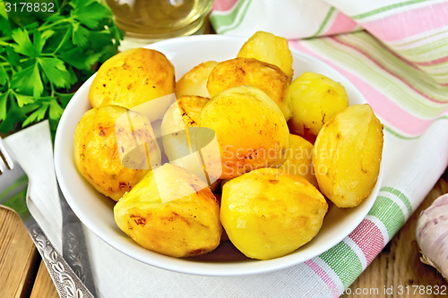 Image of Potatoes fried in plate on fabric