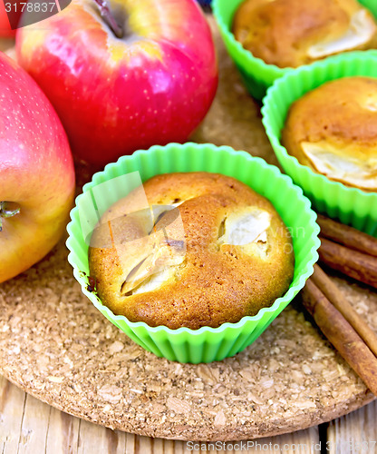 Image of Cupcake with apples on wooden board