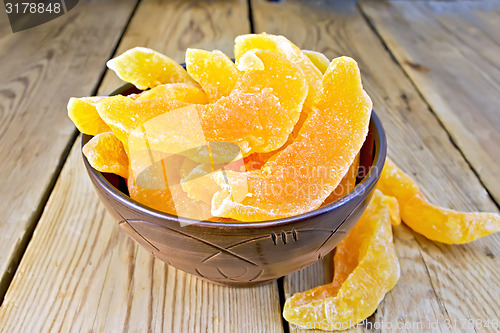 Image of Candied melon in bowl on board