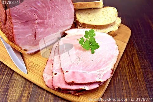 Image of Ham smoked with bread on dark board