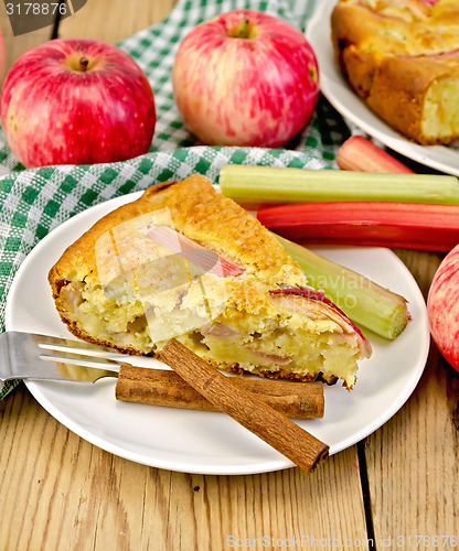 Image of Pie with apple and rhubarb in plate on board