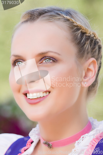 Image of Radiant young woman in a dirndl