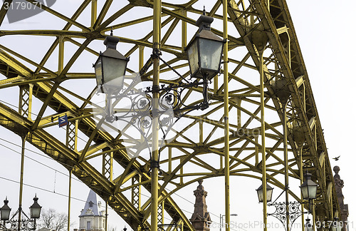 Image of Decorative lamps hanging from bridge